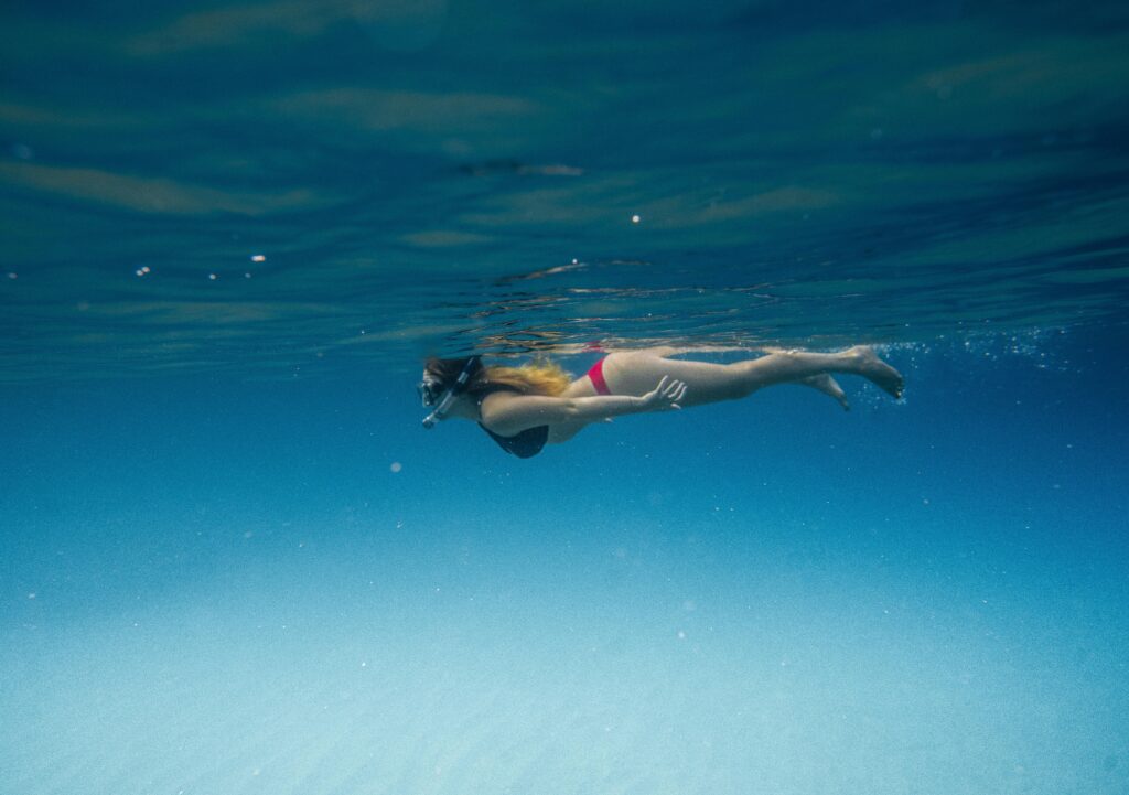 person diving under water