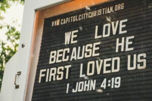 we love jesus sign