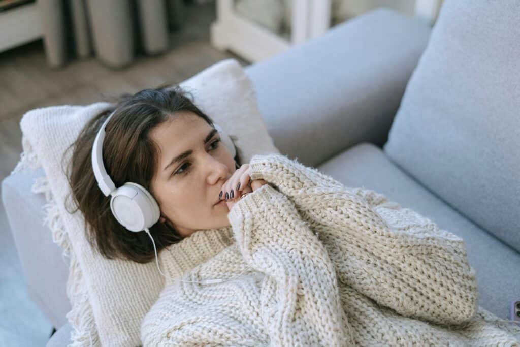 person listening to music in headphones