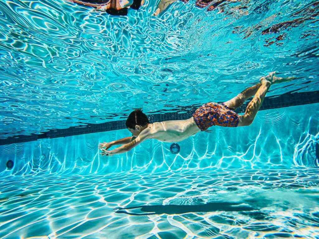 person swimming under water