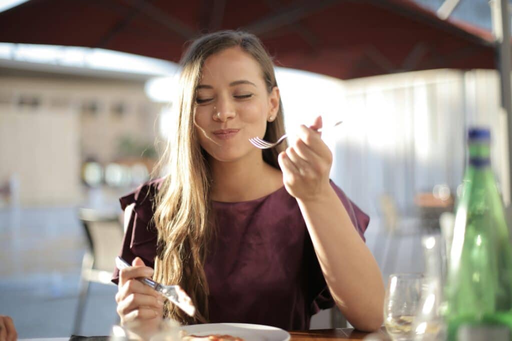 lady eating off a plater