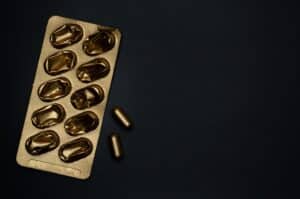 gold pill on black background