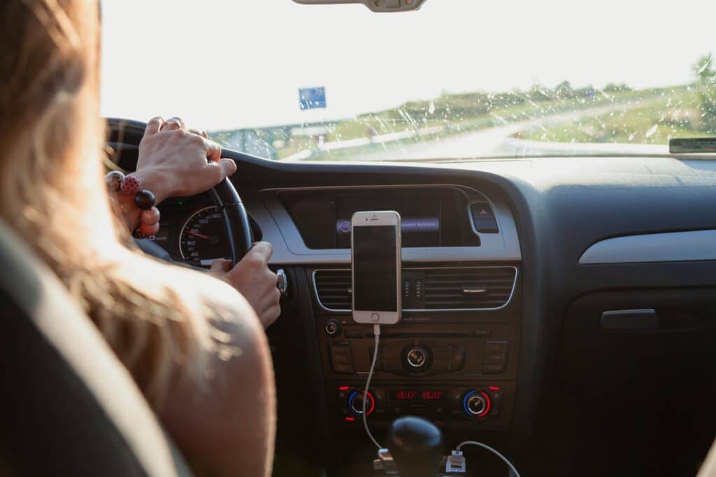 person listening to music while driving