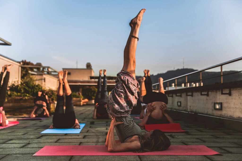 women doing yoga outside