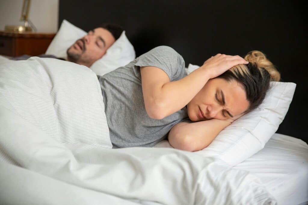 woman struggling sleeping in bed