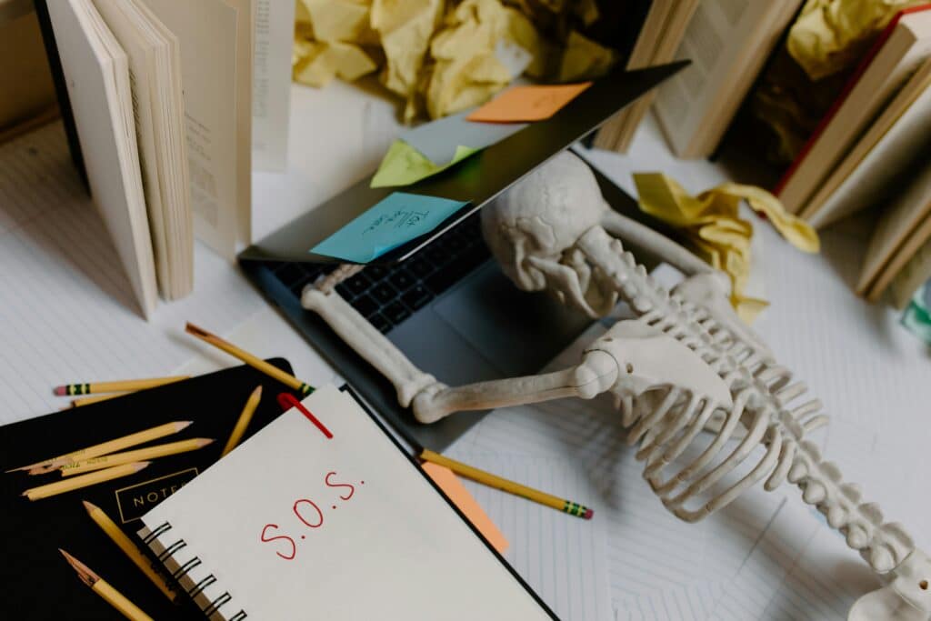 person suffering from burnout at desk