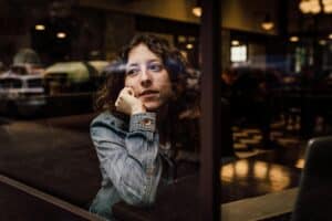 woman looking out the window
