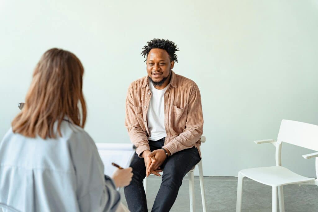 man talking to woman therapist