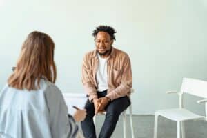 man talking to woman therapist