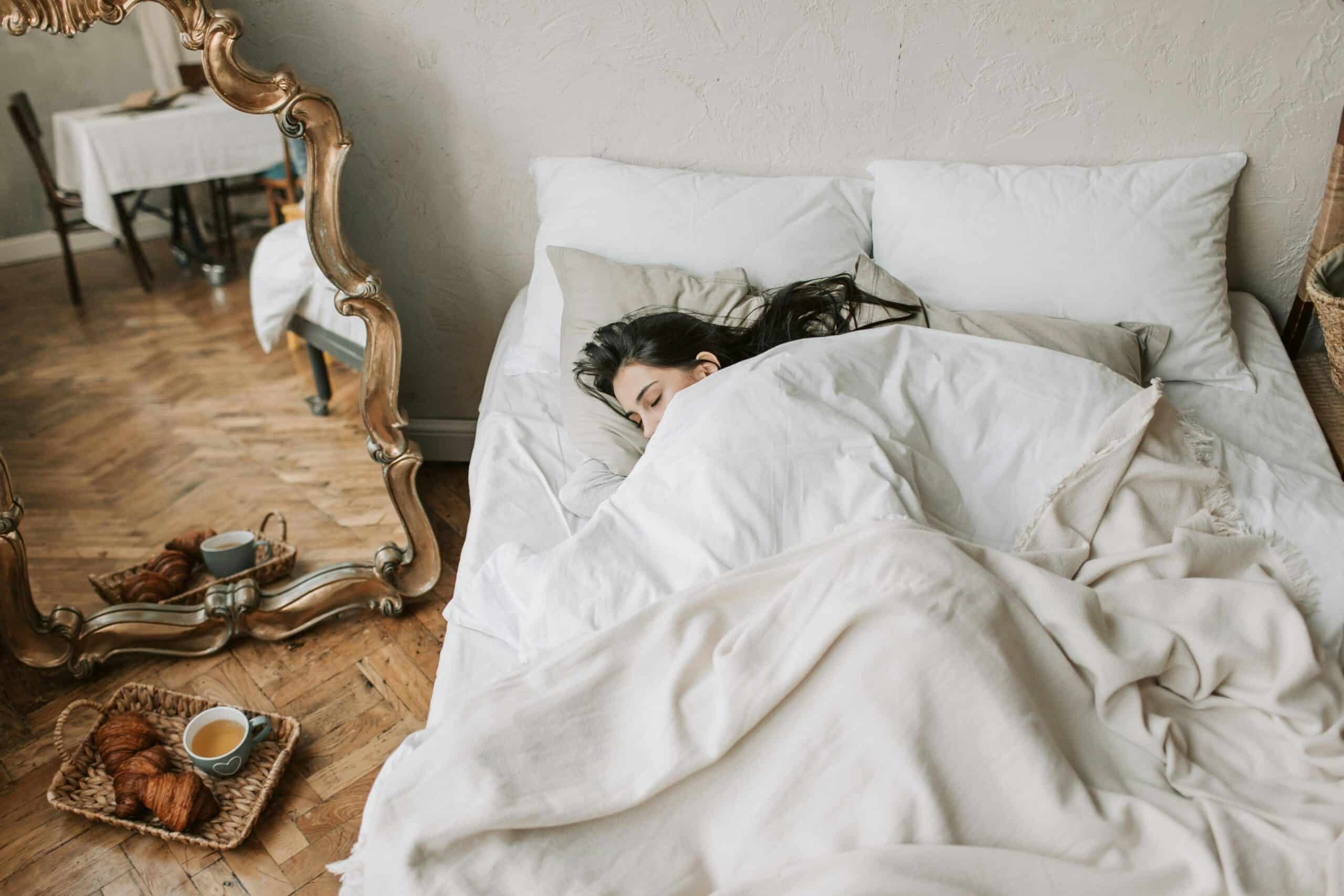 woman sleeping in her own bed