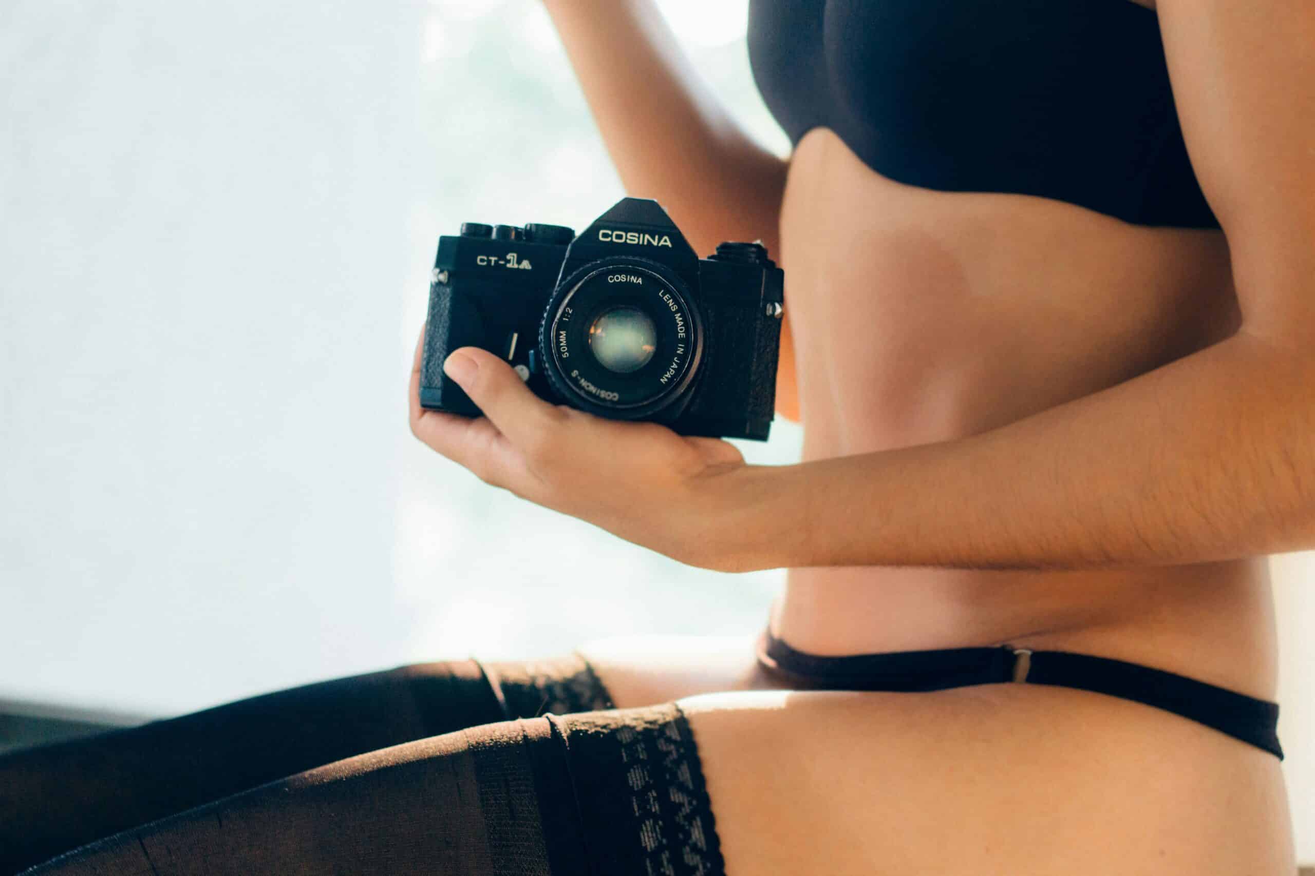 person taking a picture of a body