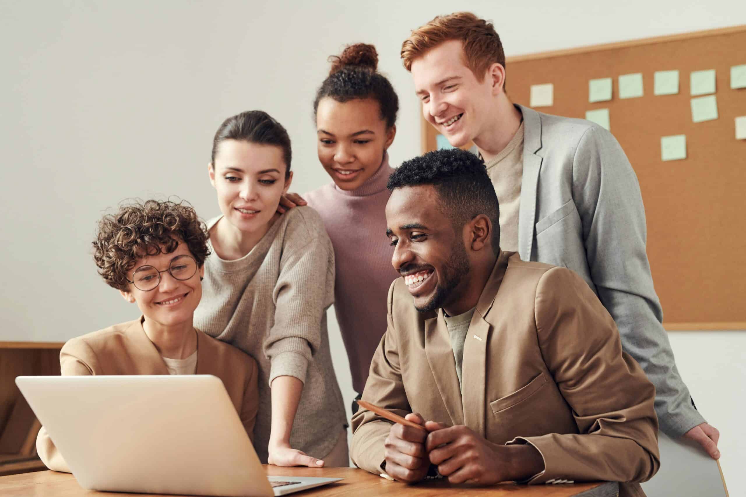 group of adults on the computer