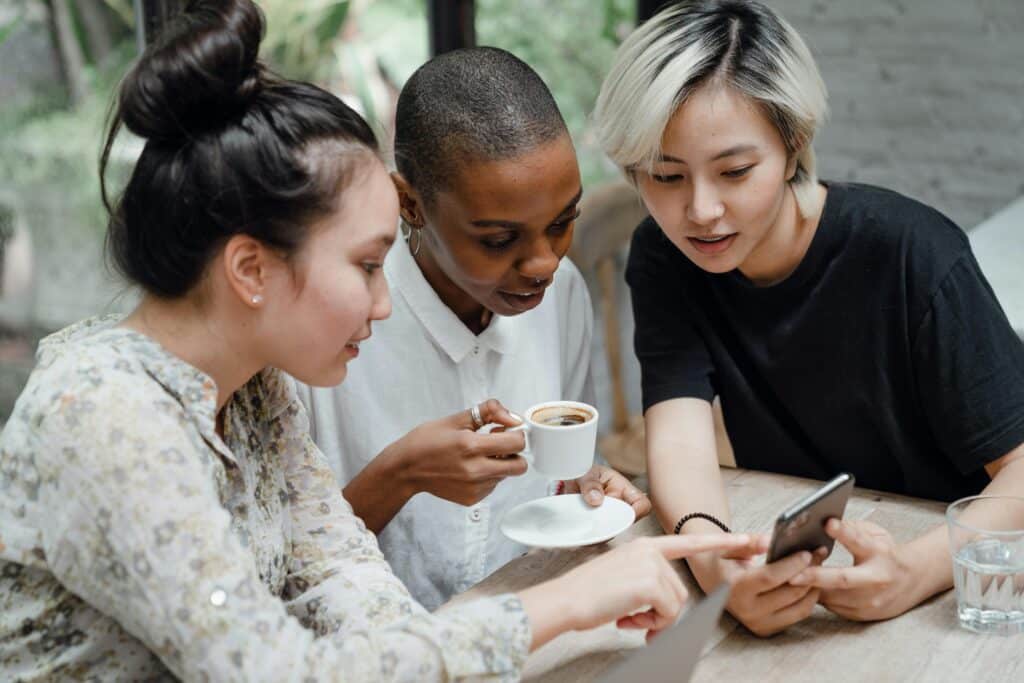 group of women looking at the screen together