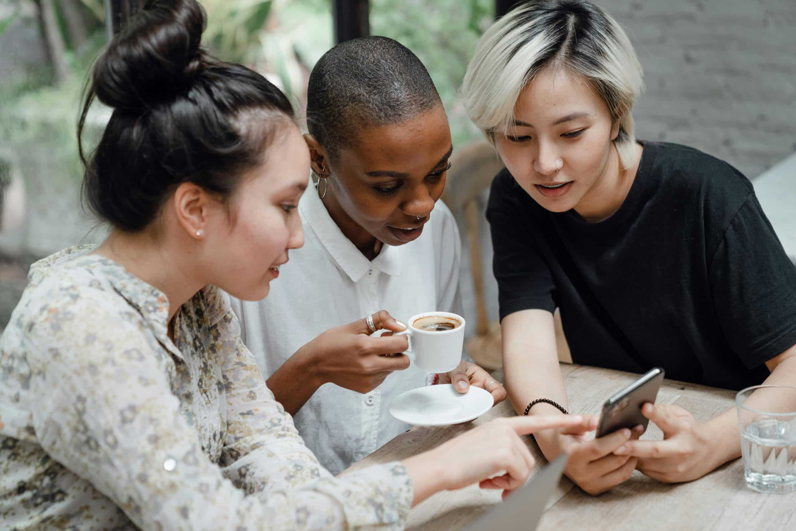 group of women looking at the screen together