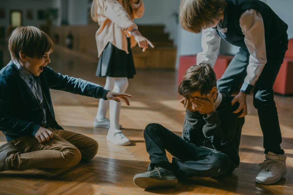 kid getting made of fun from other kids