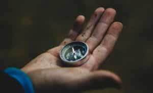 person holding a compass